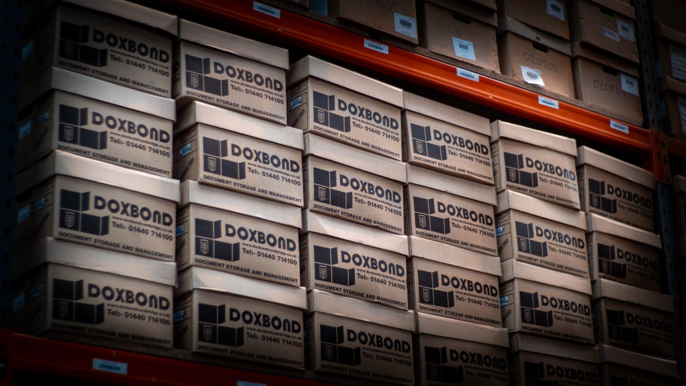 Large warehouse full of brown boxes containing documents