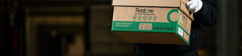 Man holding a recovery management storage box